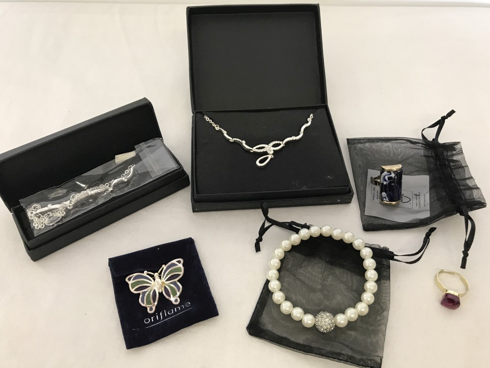 A collection of silver and gold tone costume jewellery by Oriflame in original boxes and packaging.