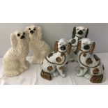A collection of Staffordshire ceramic fire dogs to include a pair of lustre spaniels.