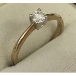 A 9ct gold 1/4 ct diamond solitaire ring.
