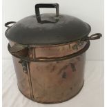 Large antique copper pan with lid, handles and pouring spout.