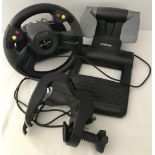 A boxed Saitek R440 Force Feedback Trans-World Racing Steering wheel control and foot pedal.