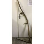 A vintage wooden curve handled scythe.