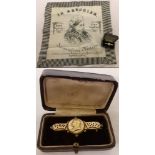 A Queen Victoria 1897 Jubilee part gold brooch together with a Victoria In Memorium handkerchief.