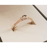 A 9ct gold solitaire diamond ring.