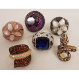 6 silver and silver gilt crystal set cocktail rings.