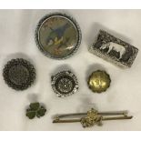 A small collection of vintage brooches to include a silver clover brooch.