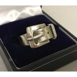 A 925 silver buckle ring.