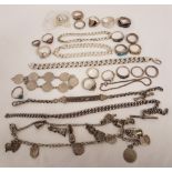 A quantity of silver and white metal rings, bracelets and chains.