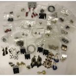 A collection of costume and silver earrings.