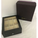 A brand new boxed Black geometric design watch box with glass top by Walwood.
