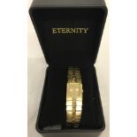 A boxed ladies gold tone quartz wristwatch by Eternity.