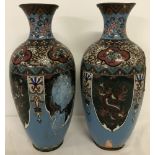 A pair of vintage cloisonné vases with pale blue background and dragon panel design.