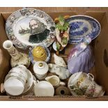 A box of vintage ceramic items.