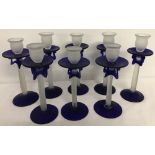A box of 8 cobalt blue and white frosted glass candlesticks.