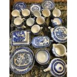 A quantity of blue & white Willow Pattern ceramics.