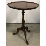 A vintage mahogany tripod based wine table with turned detail to central pedestal.
