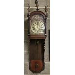 An antique Dutch wall hanging clock with brass dial and hands.