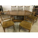 A vintage Stag extending dining table and 6 chairs (to include 2 carvers).