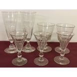 7 antique hand blown glasses with faceted bowls and 5 with knop stems.