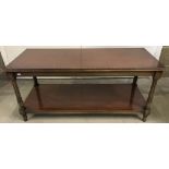 A vintage solid wood coffee table with fluted design to legs.