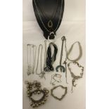 A small collection of costume jewellery to include necklaces and bracelets.