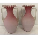 A pair of Victorian frill top pink glass 2 handled vases with pontil mark.