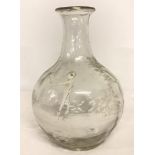 A Mary Gregory style hand blown glass vase with white overlay.