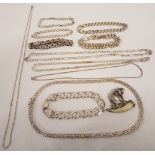 A quantity of silver and white metal chains and bracelets together with an elephant brooch.