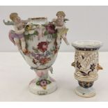 A Continental vase decorated with 2 putti and flowers.