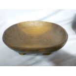 An African oval wooden bowl on four shor