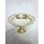 A George V silver circular pedestal swee