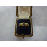 An 18ct gold dress ring set three sapphi