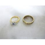 An 18ct gold engagement ring set central