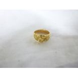 An 18ct gold dress ring with floral moun