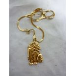 A 10ct gold lion pendant with 10ct chain