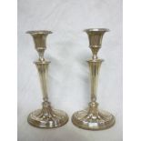 A pair of late Victorian silver candlest