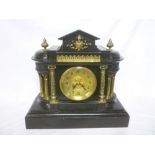 A Victorian mantel clock with gilt circu