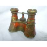 A pair of unusual painted brass opera gl