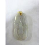 A carved jade pendant with 14ct gold mou