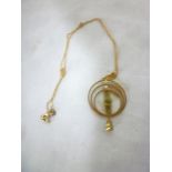 A 9ct circular pendant necklace set peri