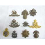 A selection of various Officers cap badges and insignia including gilt Royal Artillery cap badge,