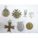 A selection of various Second War German badges and insignia including War Merit Cross without