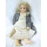 An old porcelain headed doll by Armand Marseille with sleeping eyes, open mouth, marked "390 A.3 M.