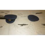 A post war RAF Officers peaked cap together similar beret and a selection of pen and ink/pencil