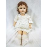 A French porcelain headed child's doll marked "Paris 301 12" with sleeping eyes,