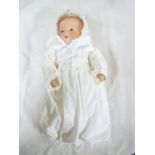 An old porcelain headed child's doll by Armand Marseille of Germany with sleeping eyes,