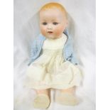 A child's old porcelain headed baby doll by Armand Marseille of Germany with painted face,