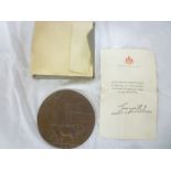 A First War bronze memorial plaque awarded to William James Charles Jeal with letter and envelope