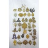 A collection of over 30 various military cap badges, mainly original including 27th Madras Infantry,