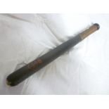An old painted police truncheon marked "S.1868 P.